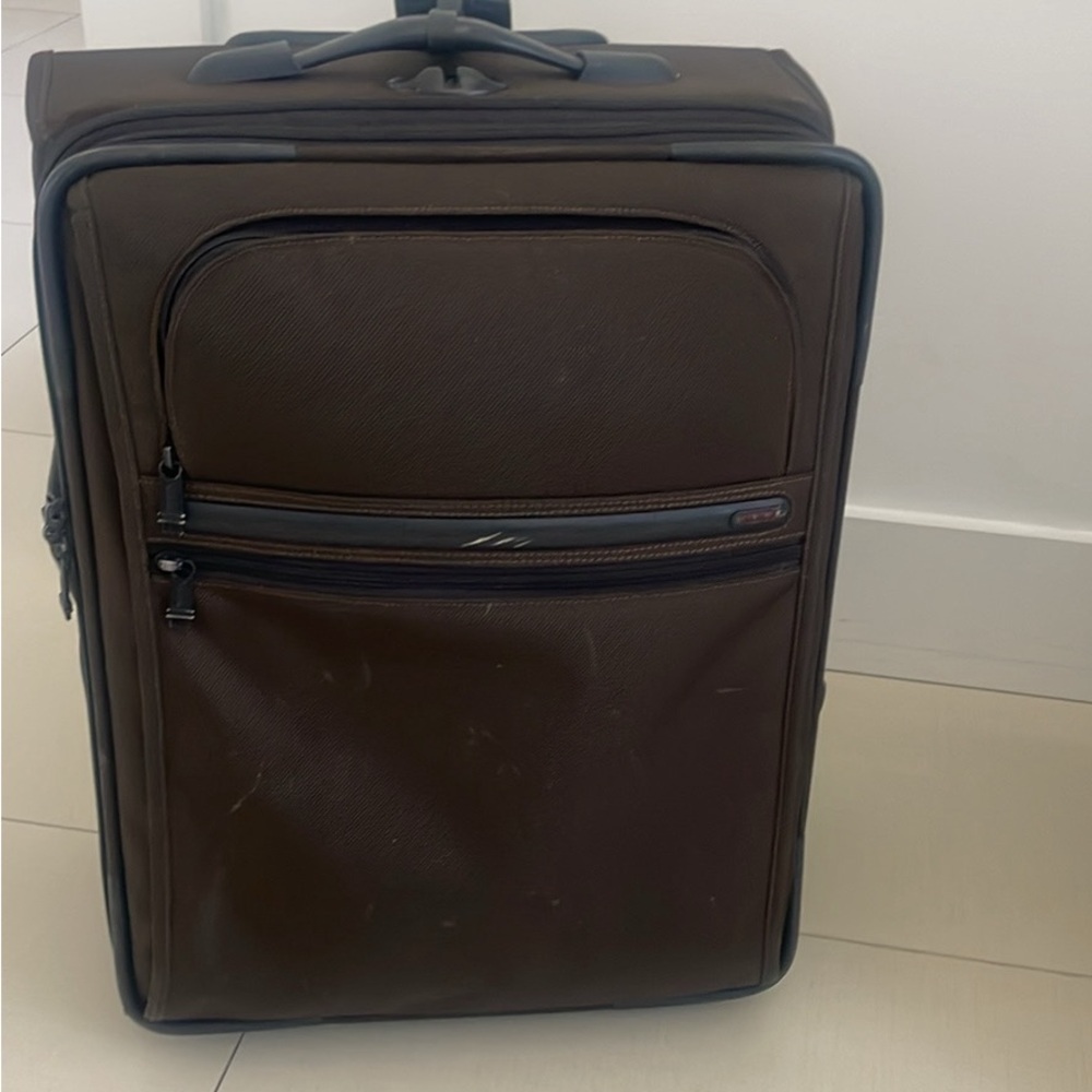 Tumi brown carry on luggage